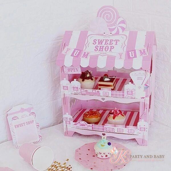Cake Stand – Sweet Shop (with logo) Pink two-tier Sweet Shop cake stand shaped like a candy shop